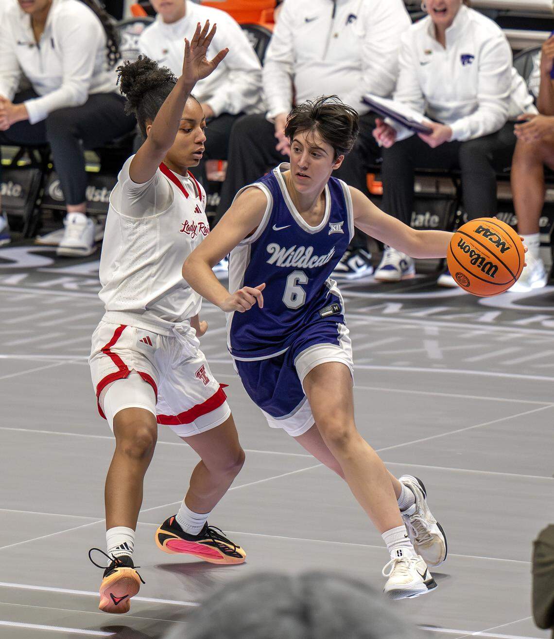 Kansas State Wildcats guard Gina Garcia (6) dribbles up the court as Texas Tech Red Raiders guard Sidney Love (10) defends during the third quarter of the Big 12 Women’s Basketball Tournament at T-Mobile Center on Thursday, March 5, 2026, in Kansas City.