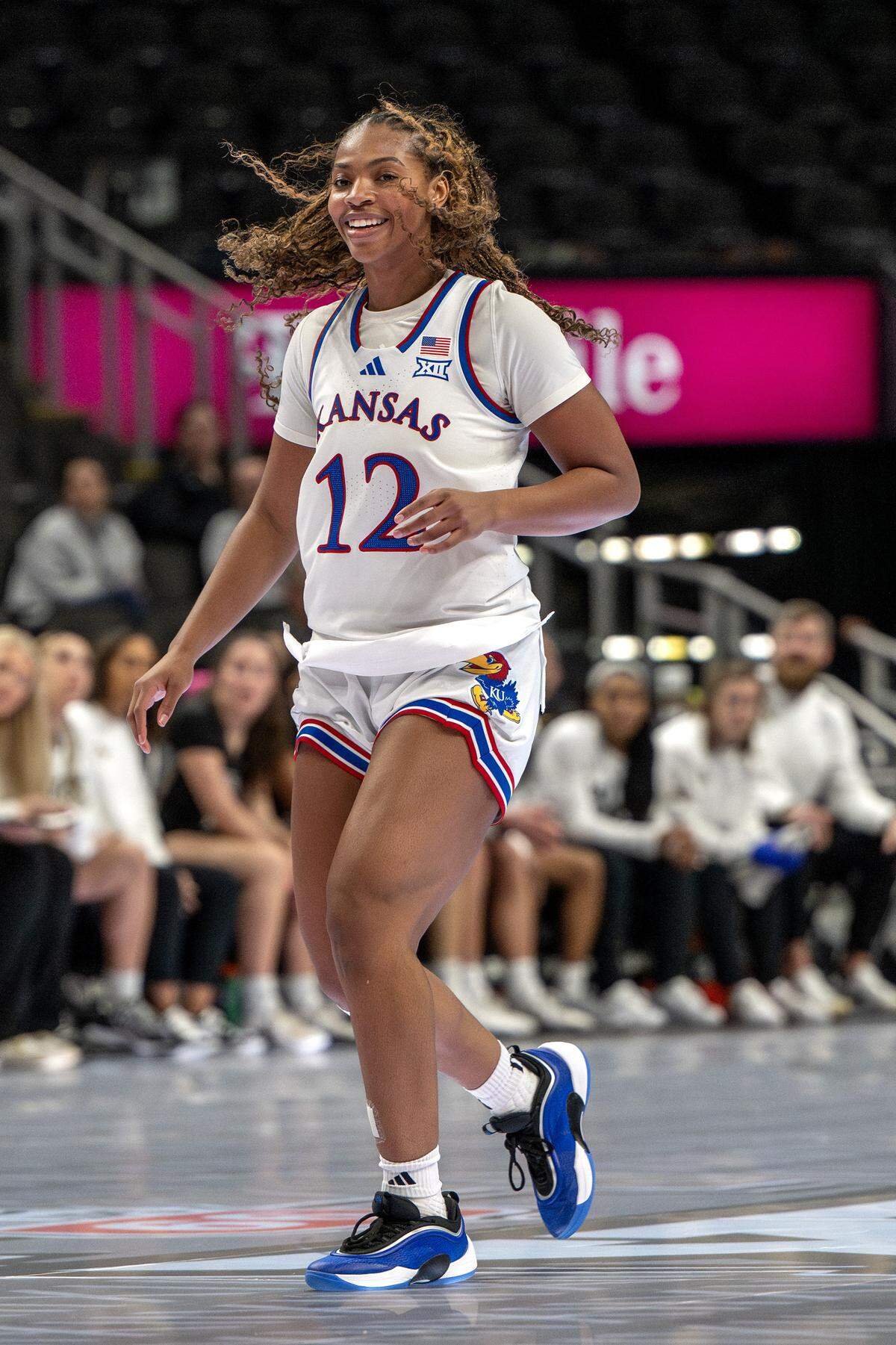 Kansas Jayhawks guard S'mya Nichols (12) smiles after making a basket against the UCF Knights during the third quarter of the Big 12 Women's Basketball Tournament at T-Mobile Center on Wednesday, March 4, 2026, in Kansas City.