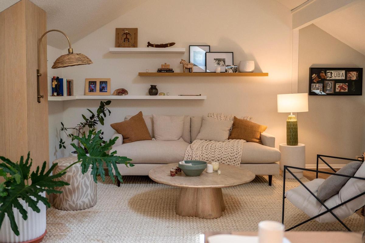 Open shelving, a new white sofa, a new desk and white cabinets for storage were part of the makeover of Suzi Sanderson’s home office in “The Gentle Art of Swedish Death Cleaning.”