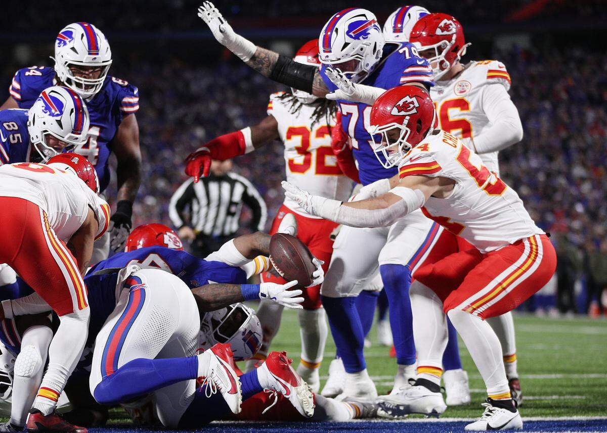 Buffalo Bills running back James Cook holds up the ball as he reaches toward the end zone during an NFL Week 9 game against the Kansas City Chiefs at Highmark Stadium in Orchard Park, New York, on Sunday, Nov. 2, 2025.