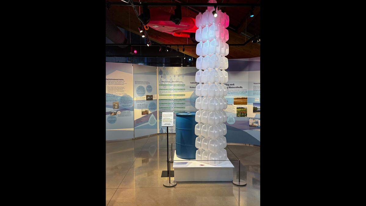 A tower of 100 plastic gallon jugs are part of the Ripples exhibit at the Johnson County Museum. The tower represents the average of amount of water a Kansan uses in one day.