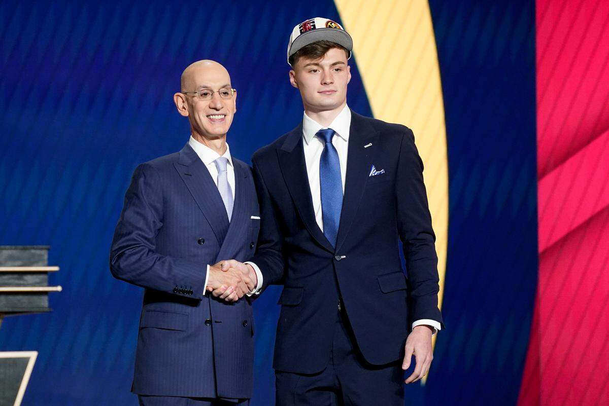 Christian Braun was congratulated by NBA Commissioner Adam Silver after being selected 21st overall by the Denver Nuggets in the 2022 NBA Draft in New York.