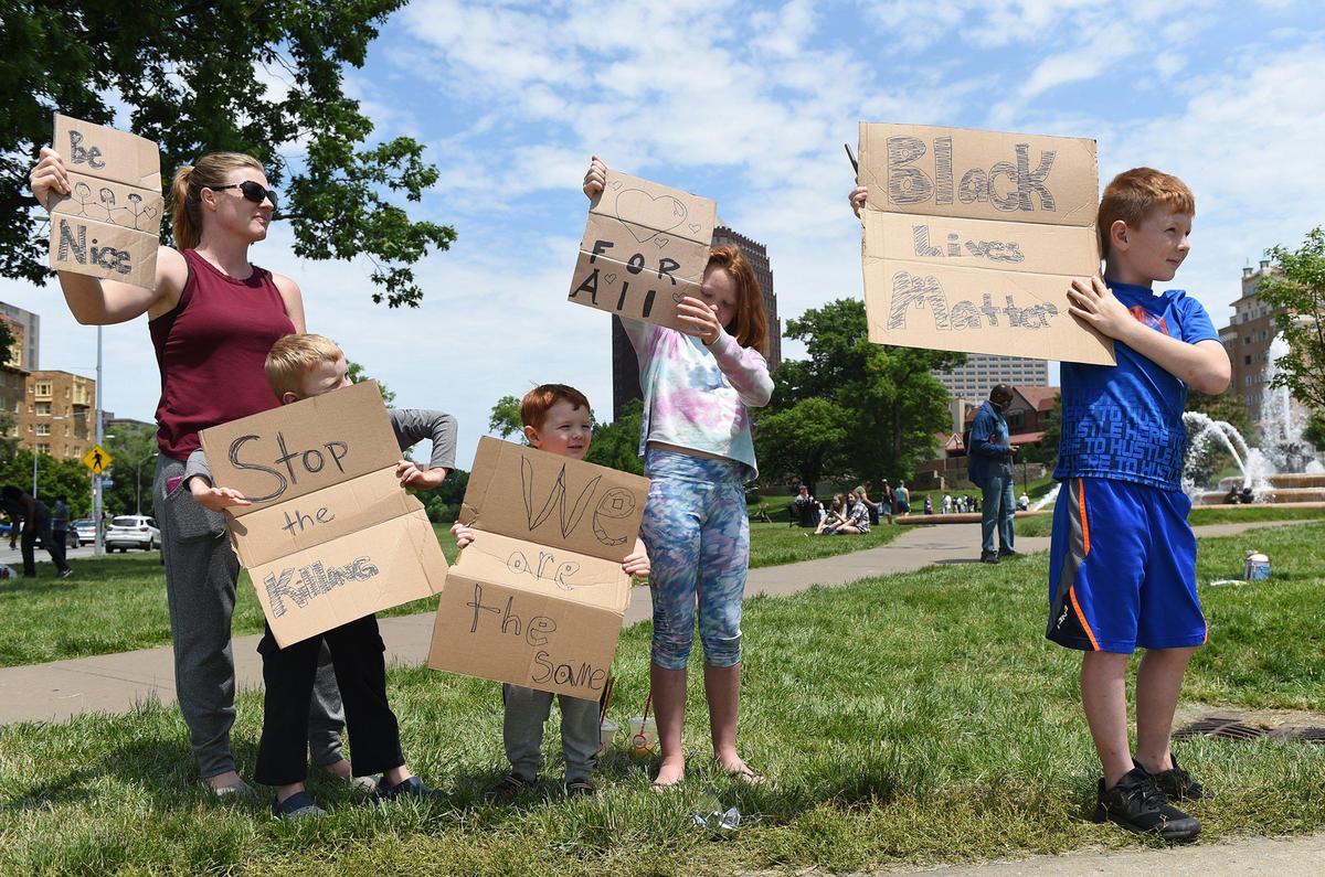 Terri Rose of Olathe took her children to the George Floyd protests which continued at the Country Club Plaza on Sunday, May 31, 2020 in Kansas City. Violent protests have been erupting all over the country after George Floyd, an African American, died in police custody in on Memorial Day in Minneapolis.