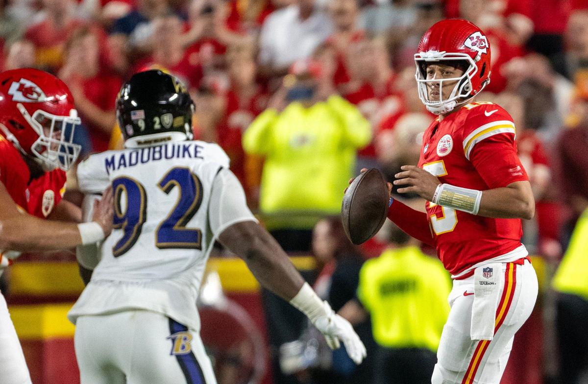 Kansas City Chiefs quarterback Patrick Mahomes (15) looks for a receiver before passing to break a record held by Len Dewson against the Baltimore Ravens in the first half on Thursday, Sept. 5, 2024, at GEHA Field at Arrowhead Stadium.