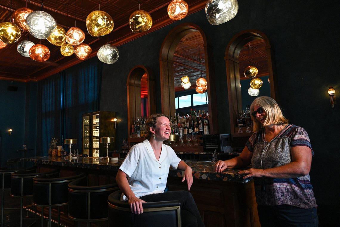 Laura Wagner, left, relocated from Kansas City to manage three new businesses — Perrenoud’s Cocktail Bar, HoneyBee Bruncherie and The Bailey Hotel — in a renovated historic building owned by Jane Works, right, and her husband Joe Works.