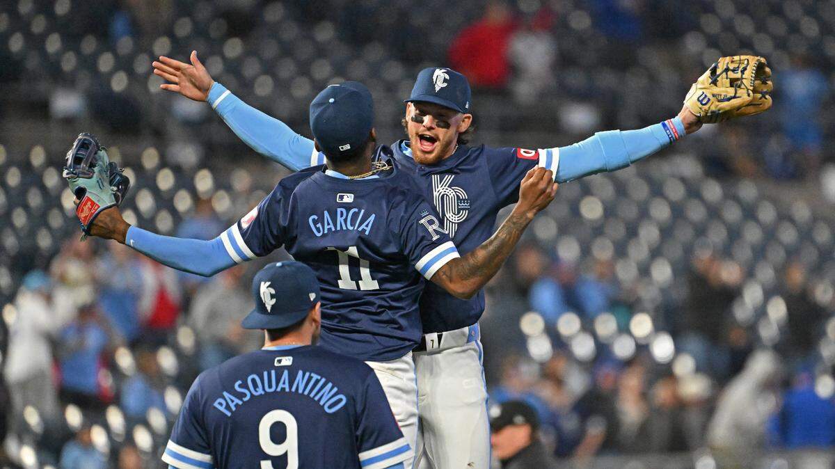 Kansas City Royals shortstop Bobby Witt Jr. (7), Maikel Garcia (11) and Vinnie Pasquantino (9) celebrate after beating the Chicago White Sox at Kauffman Stadium on April 5, 2024.