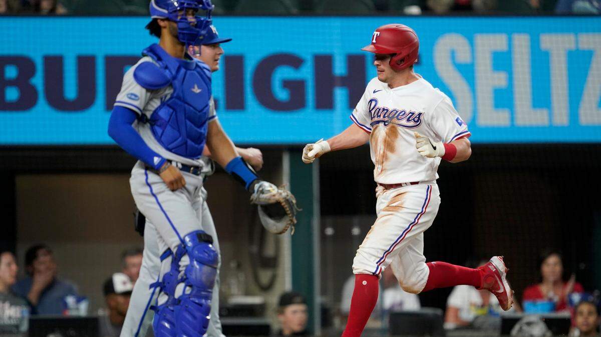 Kansas City Royals right fielder MJ Melendez stands by the plate as Texas Rangers’ Nick Solak scores on a Brad Miller single in the fifth inning of a baseball game, Tuesday, May 10, 2022, in Arlington, Texas. (AP Photo/Tony Gutierrez)