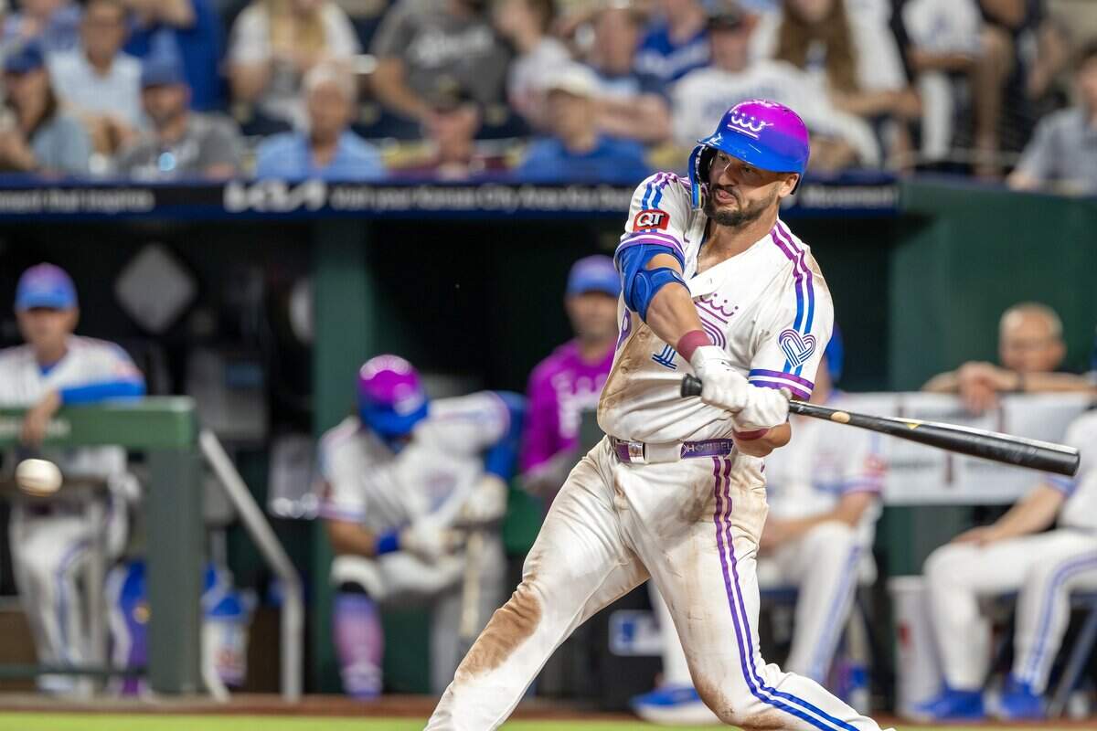 Wearing the Kansas City Royals' new "Forever Fountains" City Connect uniform, first baseman Vinnie Pasquantino (9) hits a single in the eighth inning against the Houston Astros on Friday, June 12, 2026, at Kauffman Stadium in Kansas City.