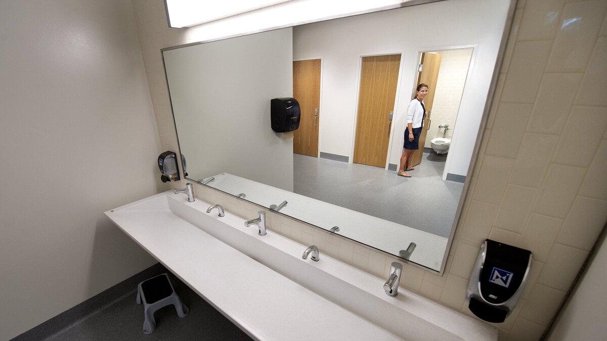 Kate Place, principal of the new Rising Hill Elementary School in the North Kansas City district, gave a tour of the new gender-neutral restrooms.
