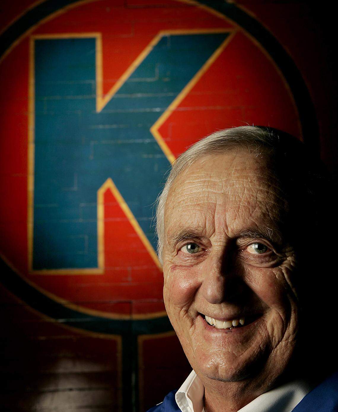 Max Falkenstien was around KU athletics longer than the original jump circle behind him in this photo from Allen Fieldhouse. Falkenstien called his last home basketball game in 2006, as he wrapped up 60 years as the voice of the Jayhawks.