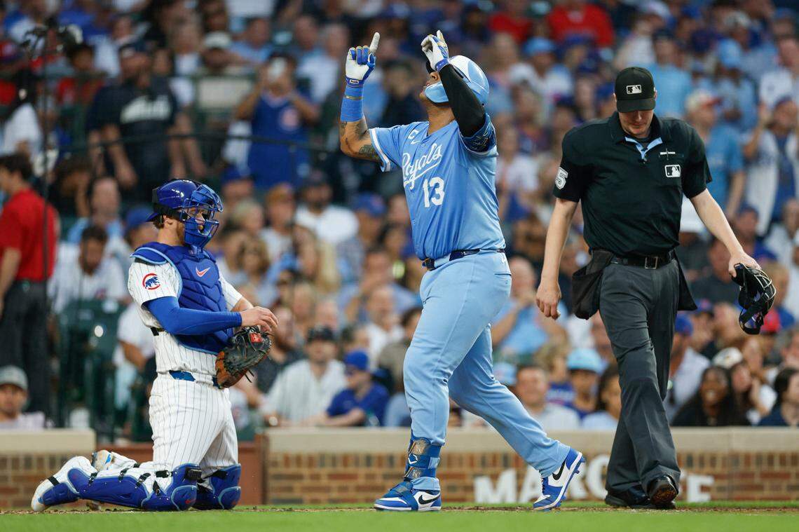 Kansas City Royals captain Salvador Perez points skyward as he crosses home plate after homering in the fourth inning of a Monday, July 21, 2025 Major League Baseball game against the Cubs at Wrigley Field in Chicago.