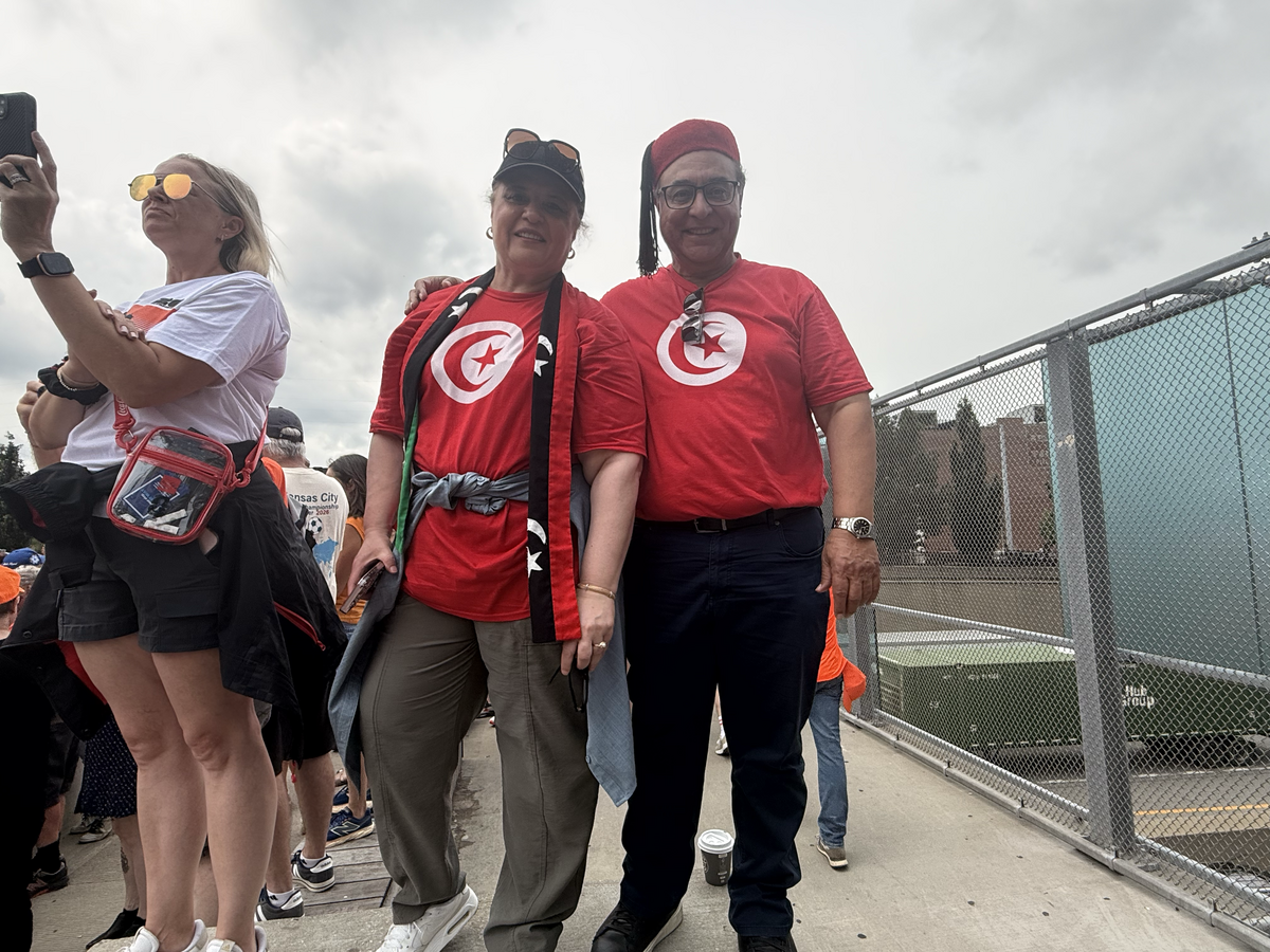 Libyan fans Nabil Elshaari and Sabah Elshaari enjoyed the Dutch fans’ “Orange Walk” parade through downtown Kansas City on Thursday, June 25, 2026.