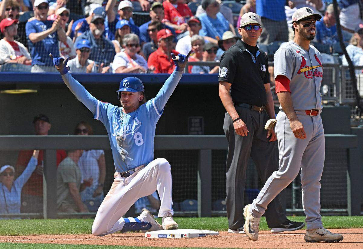 Kansas City Royals pinch hitter Drew Waters (8) reacts after hitting a triple in the seventh inning, as St. Louis Cardinals third baseman Nolan Arenado (28) looks on at Kauffman Stadium on May 18, 2025 in Kansas City, Missouri, USA.