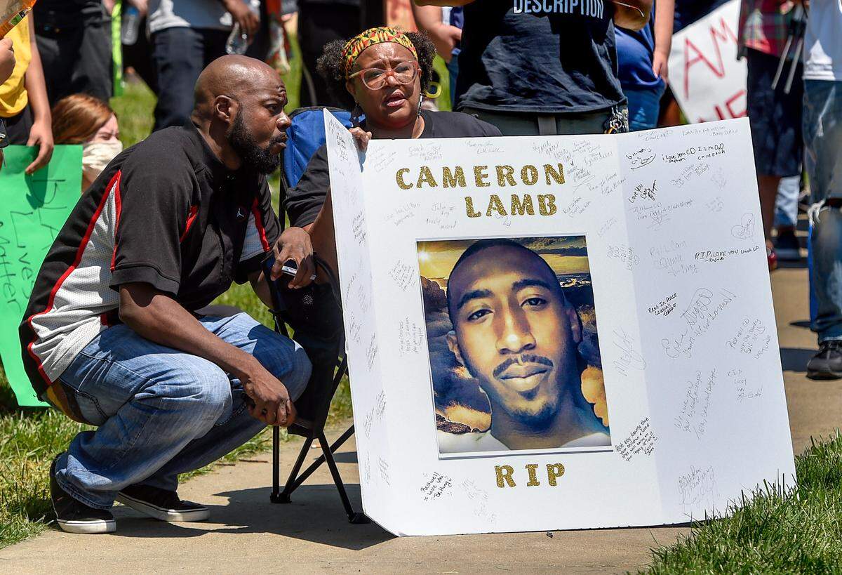 Family members of Cameron Lamb gathered in May 2020 at a Black Lives Matter peace protest in Mill Creek Park on the Country Club Plaza. Lamb, 26, a father of three, was shot shot and killed by a Kansas City police detective in December 2019. The officer, who faces charges related to the shooting, was suspended with pay after the shooting but returned to work in January.