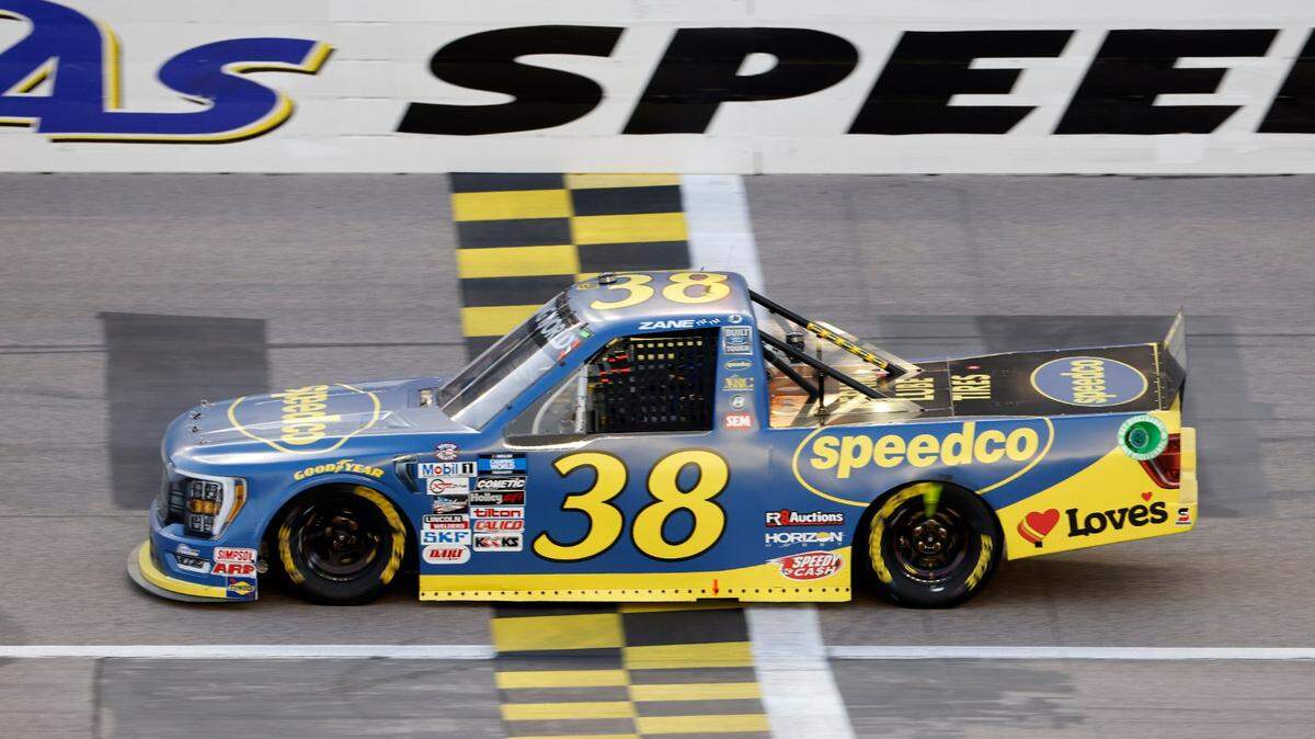 Zane Smith crossed the finish line first in the NASCAR Truck Series race at Kansas Speedway in Kansas City, Kan., on Saturday evening.