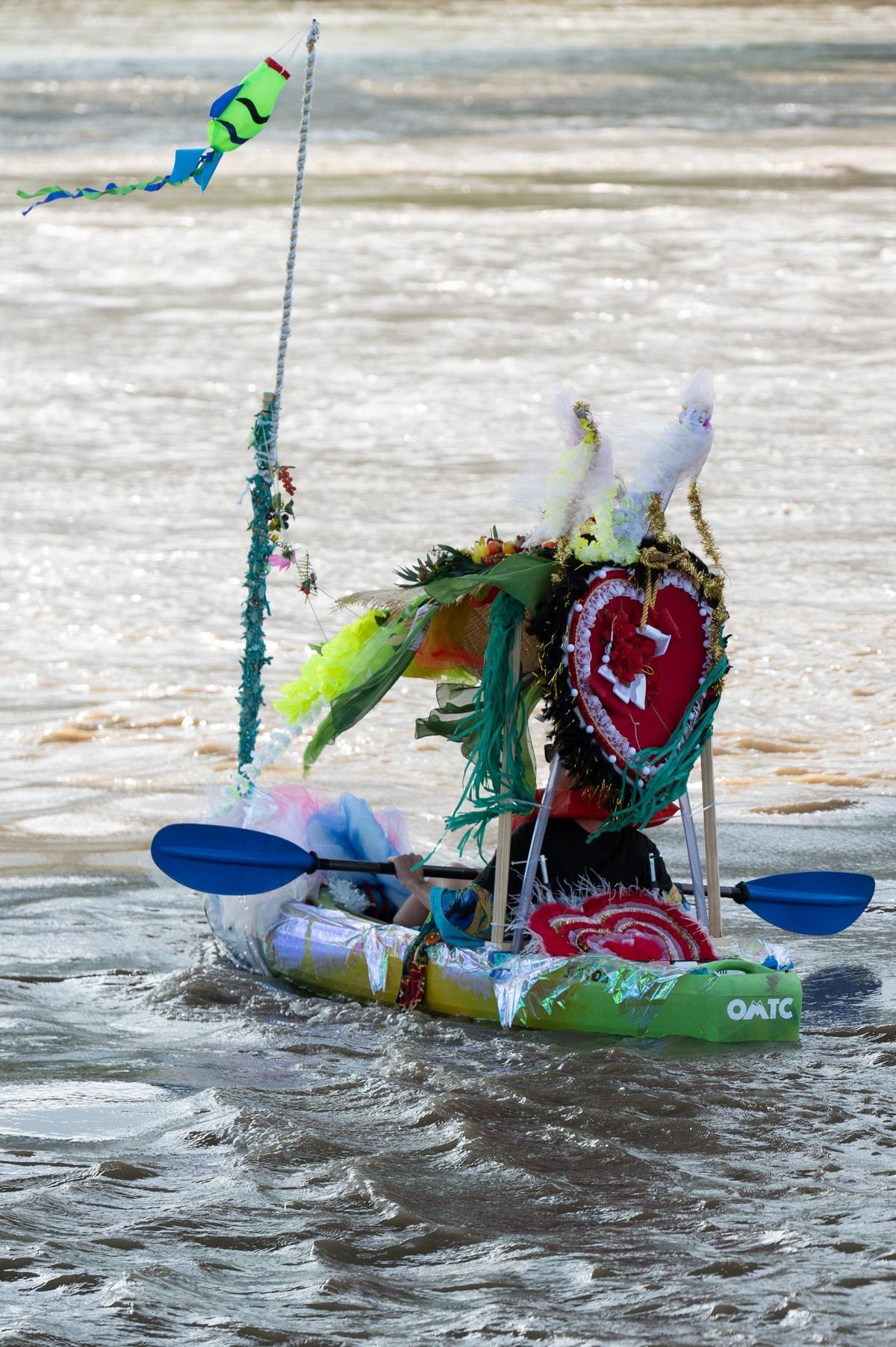 Participants in the Kawsmouth River Carnival boat parade navigated a short section of the Missouri River on Saturday, June 8, 2024, from Kaw Point in Kansas City, Kansas, to the Riverfront Park boat ramp in Kansas City, Missouri.