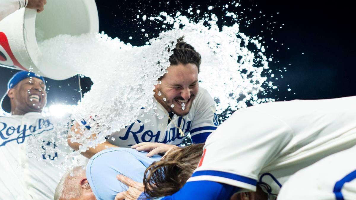 Salvador Perez and MJ Melendez dumped a cooler shaped like a QuikTrip cup on Vinnie Pasquantino and Bobby Witt Jr.