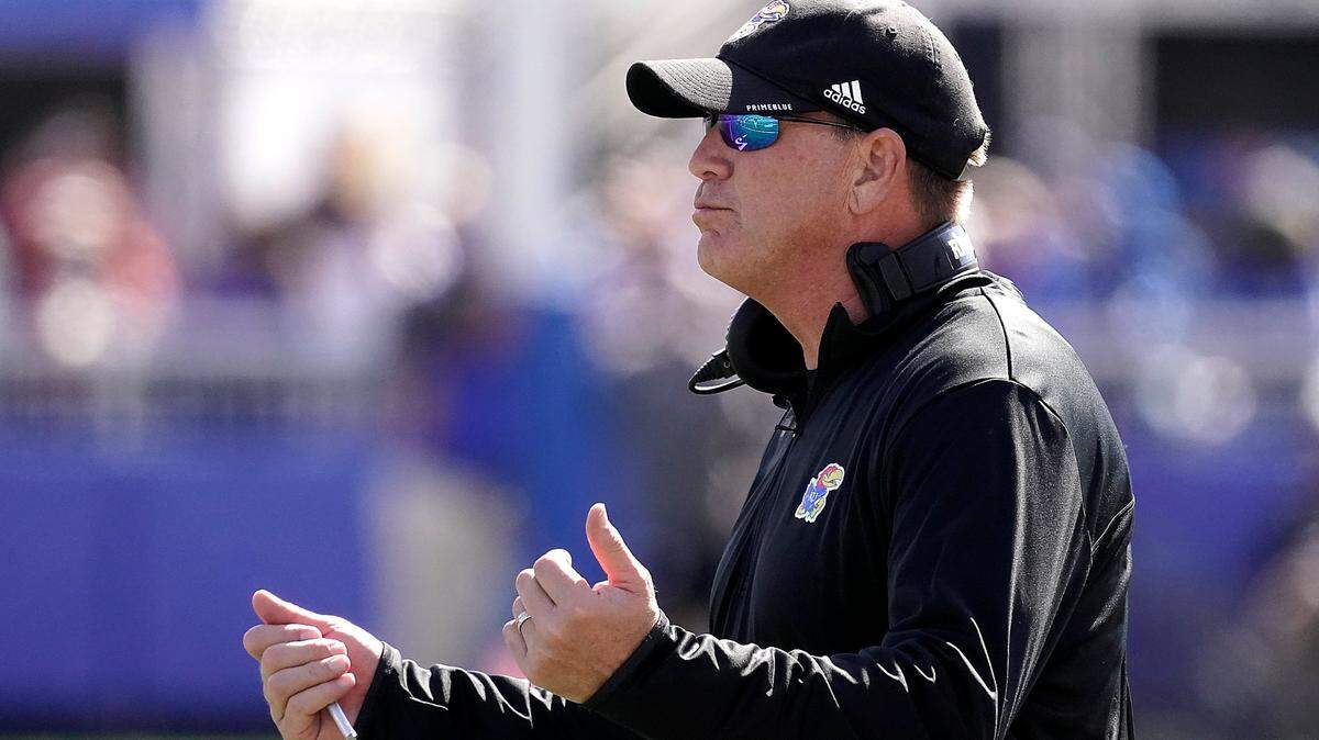 Kansas head coach Lance Leipold motions to his players during the second half of an NCAA college football game against TCU Saturday, Oct. 8, 2022, in Lawrence, Kan. TCU won 38-31. (AP Photo/Charlie Riedel)