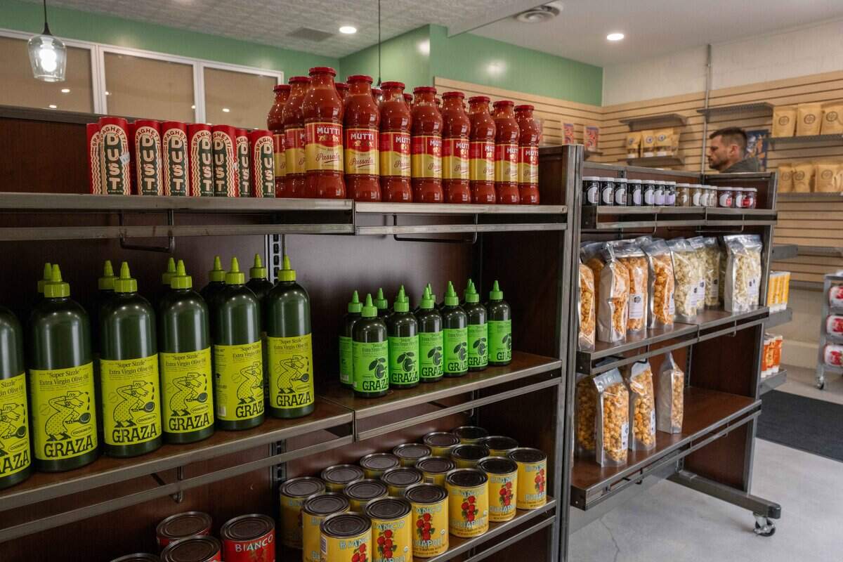 Olive oil, tomato sauce, and other grocery items at the soft opening for Bodega Bakery, a new cafe/bodega from the owner's of Blackhole Bakery, on Friday, December 12, 2025, in Kansas City.