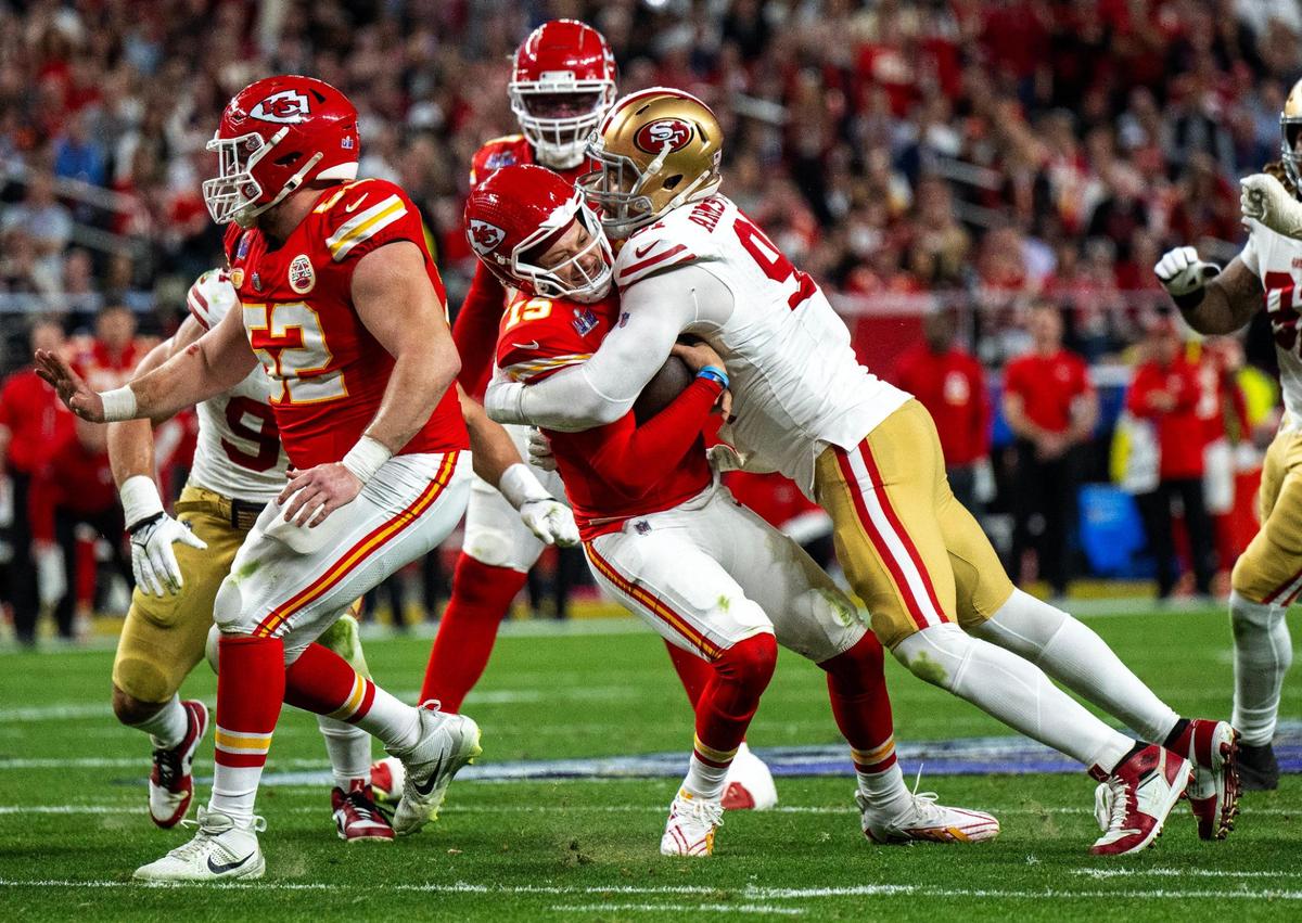 Kansas City Chiefs quarterback Patrick Mahomes (15) gets sacked by San Francisco 49ers defensive end Arik Armstead (91) during the first half of Super Bowl LVIII on Sunday, Feb. 11, 2024, in Las Vegas.
