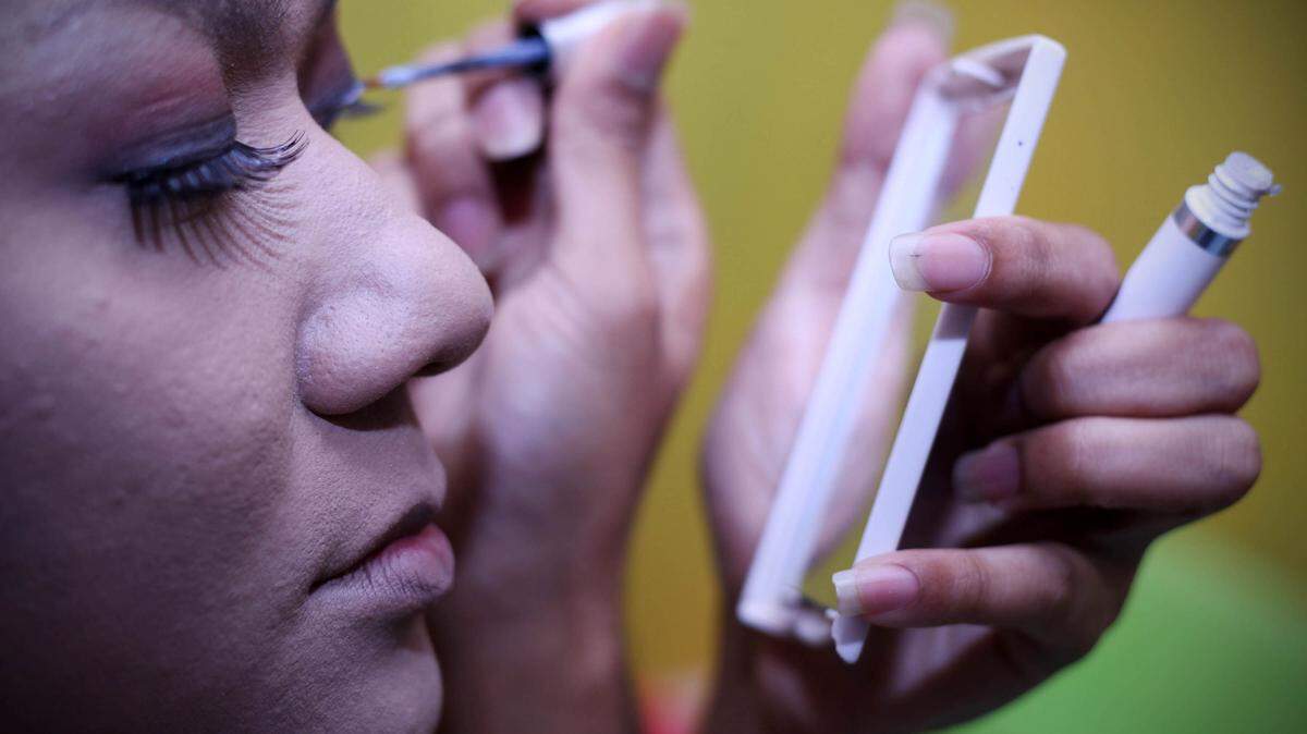 A person applying makeup.
