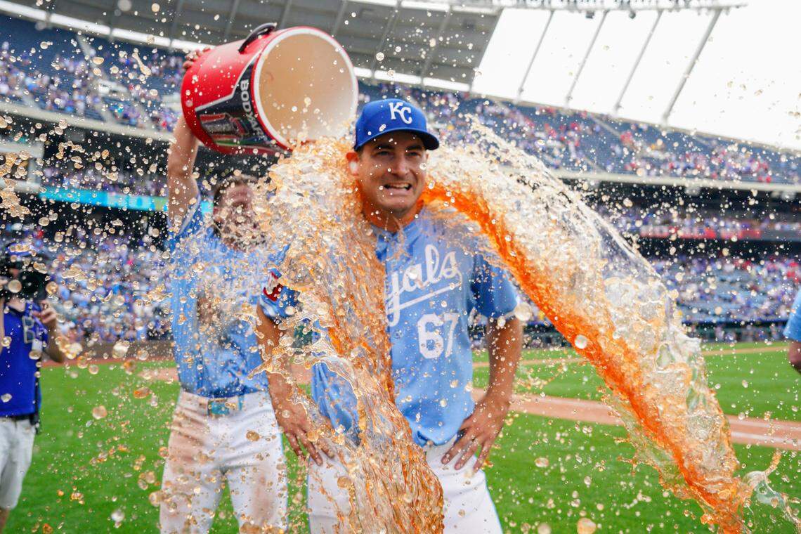Kansas City Royals shortstop Bobby Witt Jr. dumps some liquid celebration on starting pitcher Seth Lugo after the latter’s complete-game victory over the Chicago White Sox on Sunday afternoon at Kauffman Stadium.