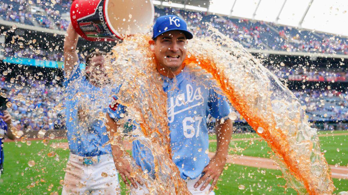 Kansas City Royals shortstop Bobby Witt Jr. dumps some liquid celebration on starting pitcher Seth Lugo after the latter’s complete-game victory over the Chicago White Sox on Sunday afternoon at Kauffman Stadium.