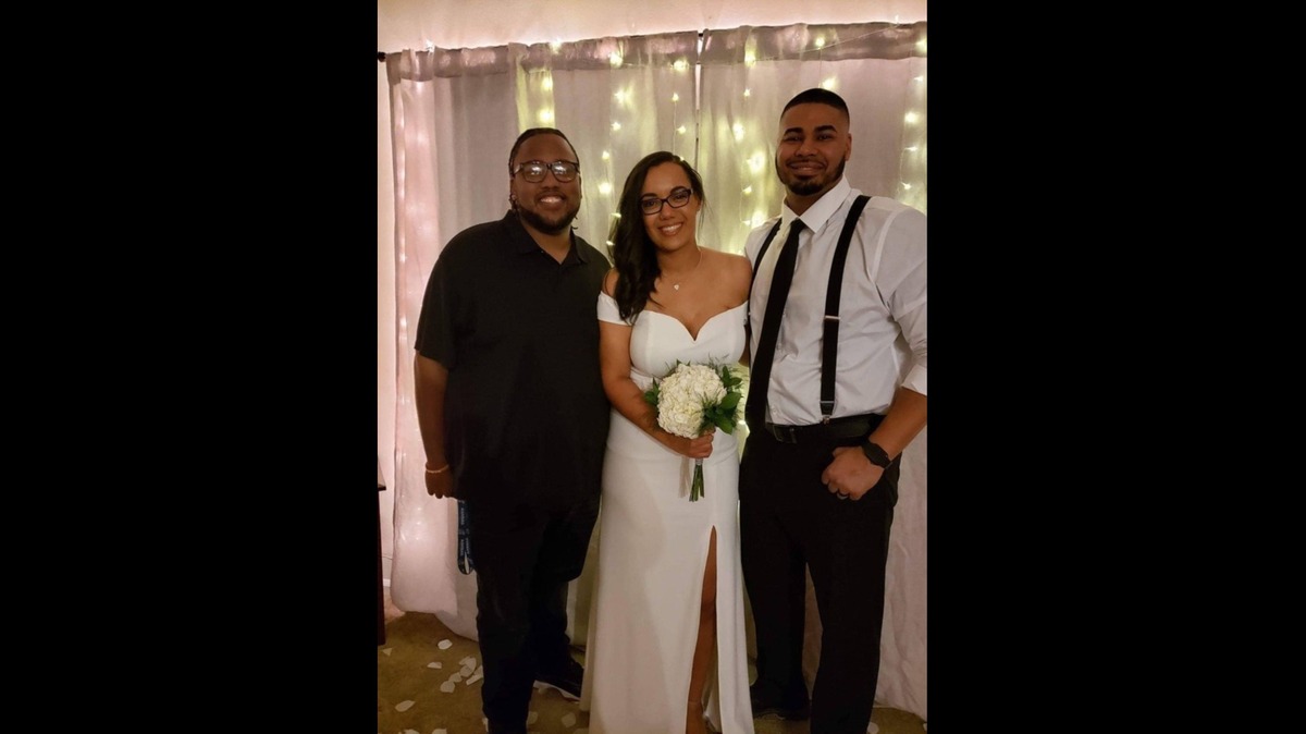 Christopher “Cheese” Burnett at the wedding of friends Keena and Kellen Long.