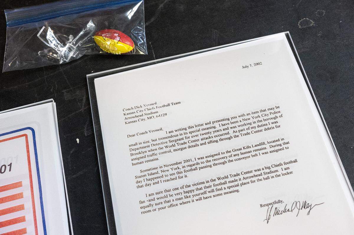 Chiefs historian Mike Davidson shows a letter sent to former Kansas City coach Dick Vermeil by a New York police detective on July 2, 2002. Stored inside the Artifact Room at the team’s underground storage facility, the correspondence recounts how the detective found a small Chiefs football trinket while searching through debris at Ground Zero following 9/11.