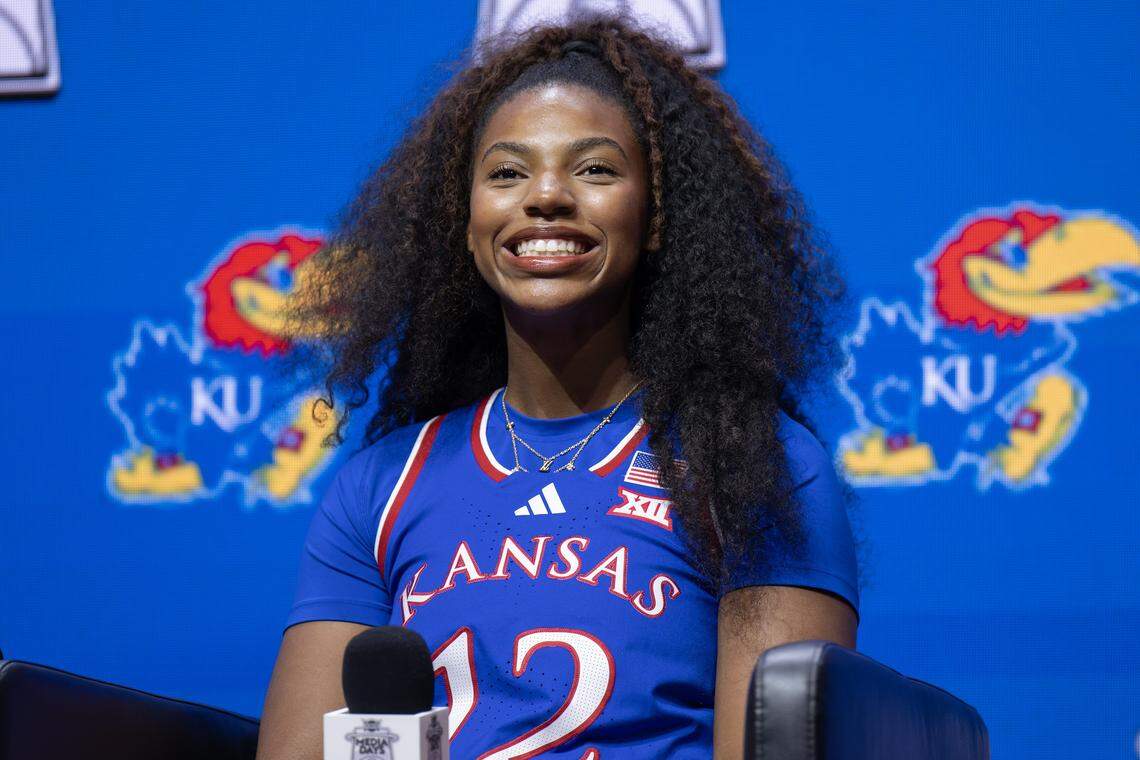 Kansas Jayhawks guard S'Mya Nichols (12) smiles while taking questions from reporters during Big 12 Media Days at T-Mobile Center on Tuesday, Oct. 21, 2025, in Kansas City