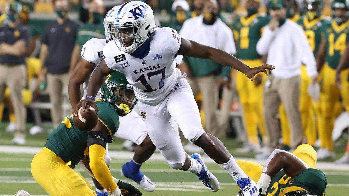 Kansas quarterback Jalon Daniels escaped the tackle by the Baylor defense in the first half in Waco, Texas, Saturday, Sept. 26, 2020. (Jerry Larson/Waco Tribune Herald, via AP)