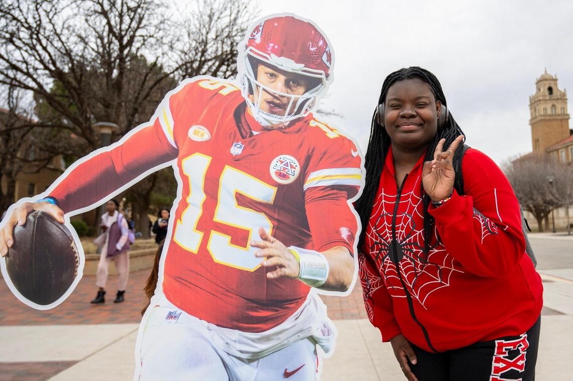 Ramyah Joshua, a Texas Tech University student, poses for a photo next to a life-size cutout featuring Kansas City Chiefs quarterback Patrick Mahomes on Tuesday, Feb. 6, 2024, at Texas Tech University in Lubbock, Texas.
