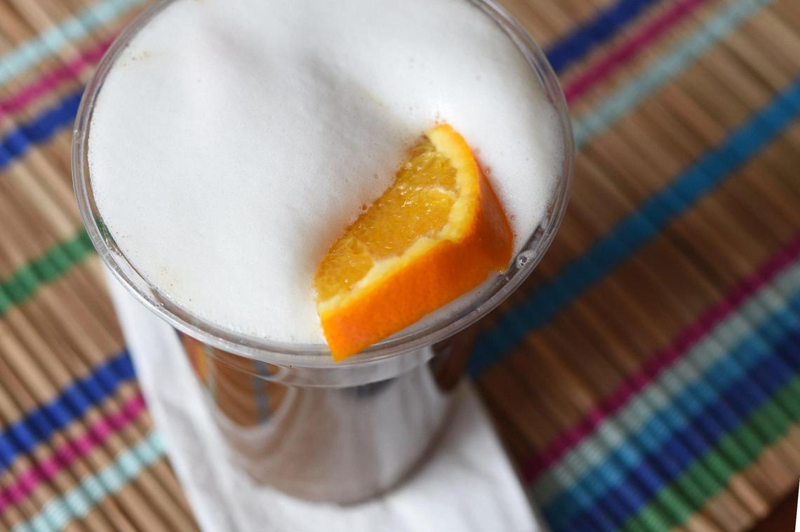 Cafe de Ollama’s CDMX Smog, a Mexico City riff on a London Fog, is made with chamomile tea, an orange slice and coffee topped with foam.