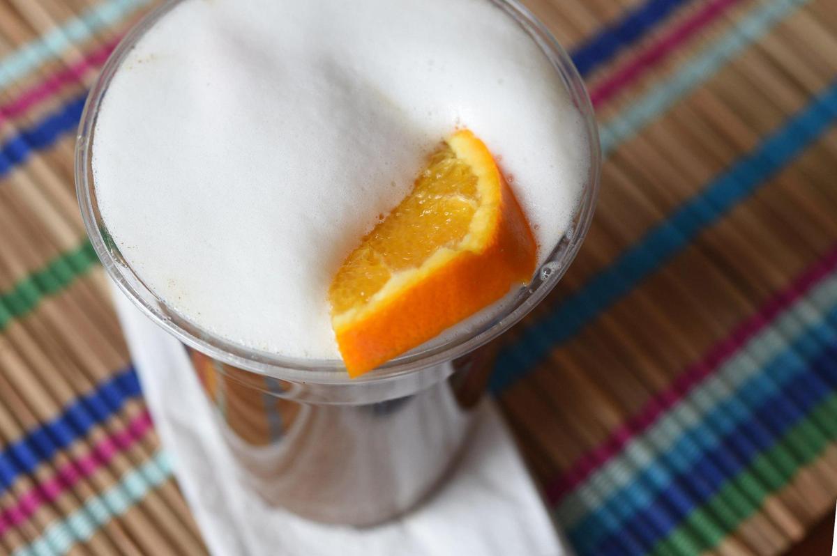 Cafe de Ollama’s CDMX Smog, a Mexico City riff on a London Fog, is made with chamomile tea, an orange slice and coffee topped with foam.