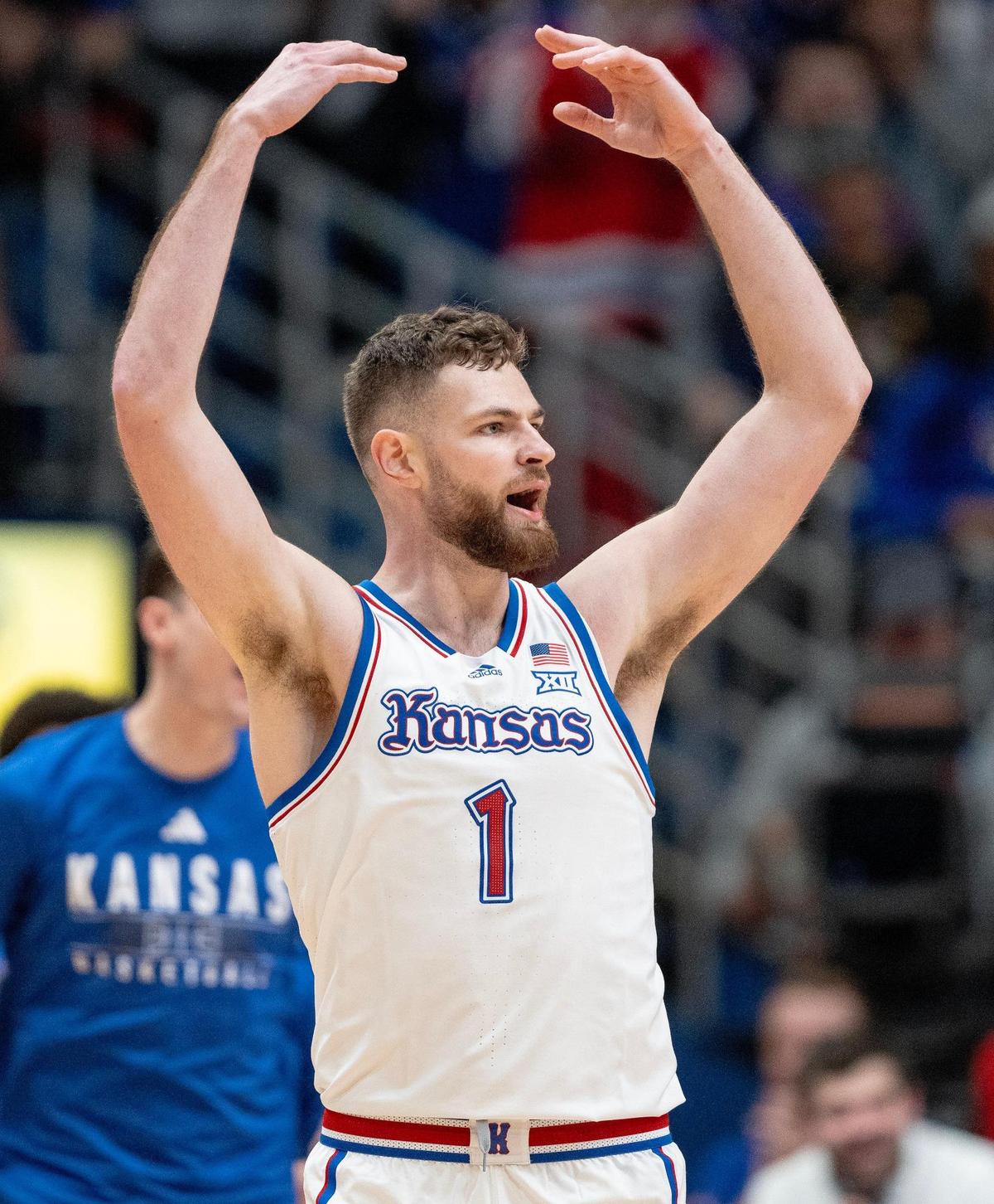 Kansas Jayhawks center Hunter Dickinson (1) celebrates a 3-pointer during an NCAA basketball game against the Connecticut Huskies on Friday, Dec. 1, 2023, in Lawrence, Kan.