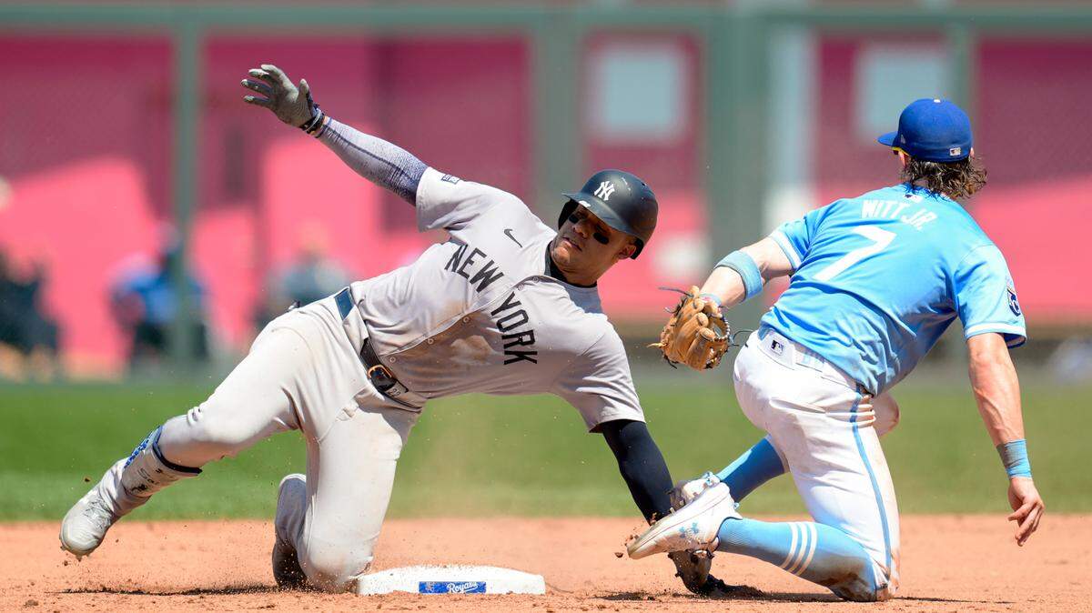 New York Yankees right fielder Juan Soto (22) is tagged out at second base by Kansas City Royals shortstop Bobby Witt Jr. (7) during the eighth inning at Kauffman Stadium on June 13, 2024.