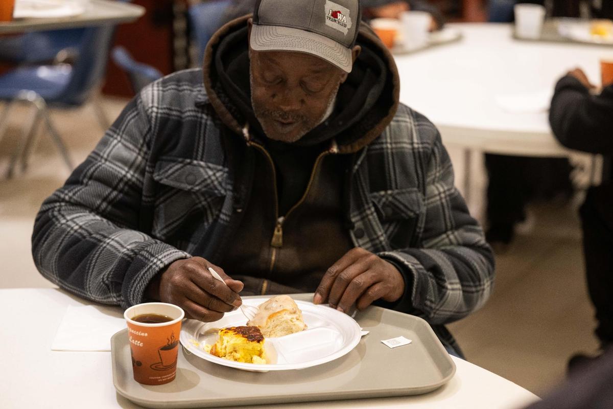 Roscoe aka ‘George of the Jungle’, enjoys a plate of food served at Morning Glory Ministries, a morning breakfast program to serve the homeless on Tuesday, Nov. 12, 2024 in Kansas City.