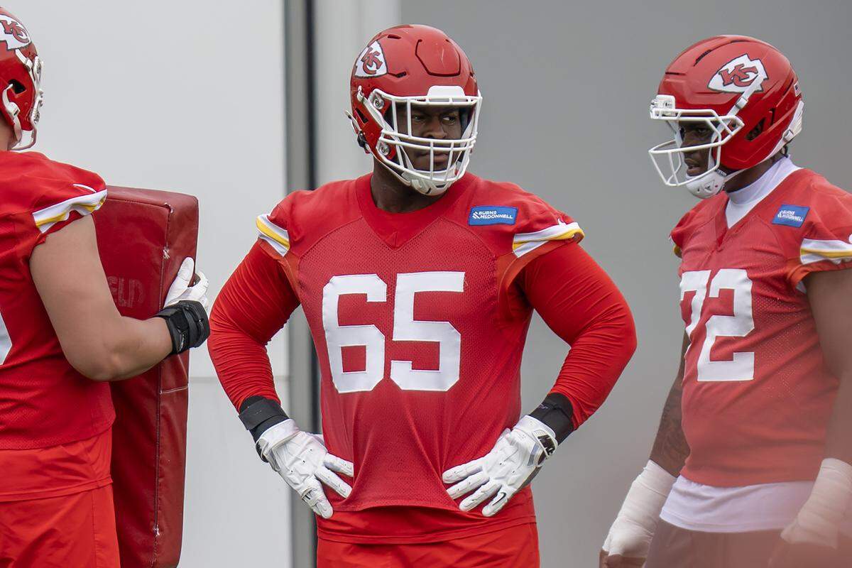 Kansas City Chiefs guard Trey Smith (65) runs a drill during practice at the Chiefs' training facility on Thursday, May 28, 2026, in Kansas City.