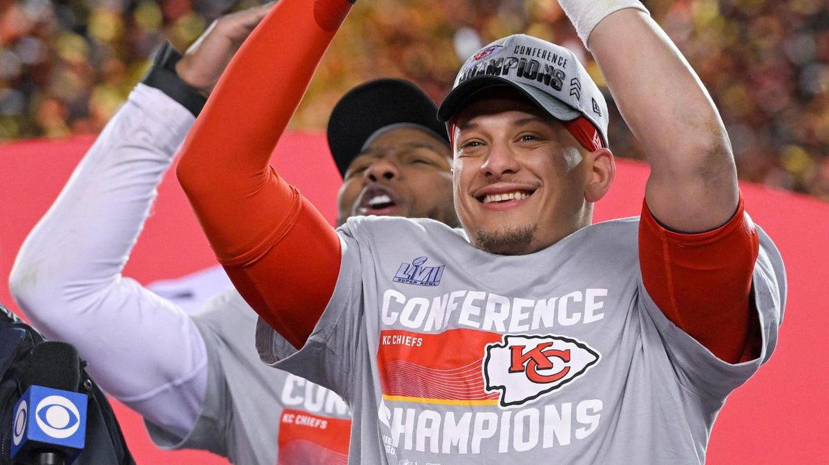 Quarterback Patrick Mahomes celebrates with the Lamar Hunt trophy after the Chiefs defeated the Cincinnati Bengals in the AFC Championship Game at GEHA Field at Arrowhead Stadium.