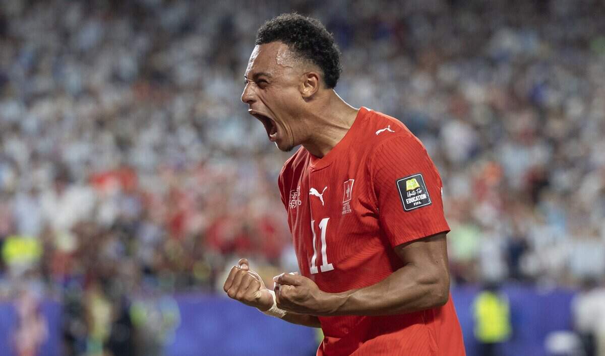 Switzerland forward Dan Ndoye (11) celebrates after scoring a goal against Argentina during the FIFA World Cup quarterfinal match at Kansas City (Arrowhead) Stadium in Kansas City on Saturday, July 11, 2026.
