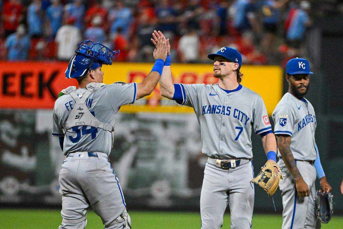 Kansas City Royals catcher Freddy Fermin, left, high-fives shortstop Bobby Witt Jr. after the visitors’ victory in the nightcap of a split doubleheader against the St. Louis Cardinals on Wednesday at Busch Stadium.