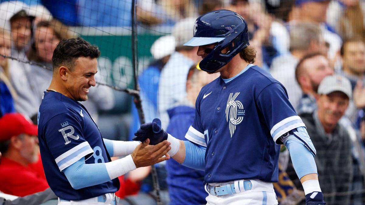Kansas City Royals rookie Bobby Witt Jr. (right) is congratulated by Nicky Lopez after hitting his first career home run, during the second inning of the team’s baseball game against the St. Louis Cardinals in Kansas City, Mo., Tuesday, May 3, 2022.