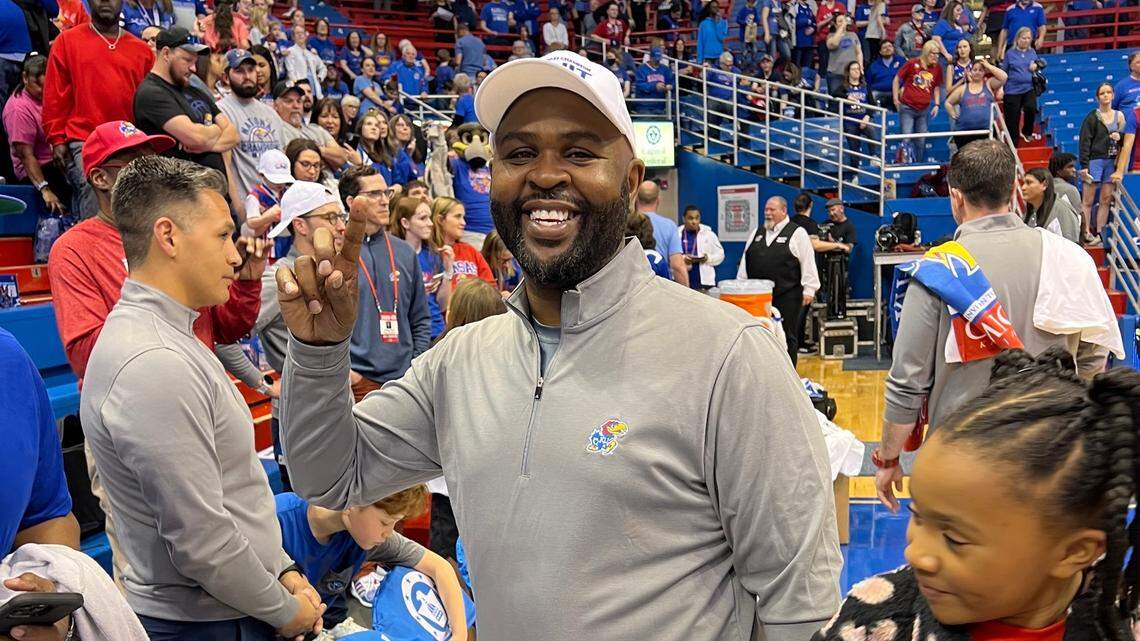 Terry Nooner, associate head coach for the Kansas women’s basketball team, celebrates after the Jayhawks won the WNIT championship game on April 1, 2023.