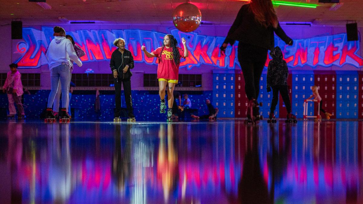 Skaters dance in the middle of the arena at Winwood Skate Center on in Kansas City.
