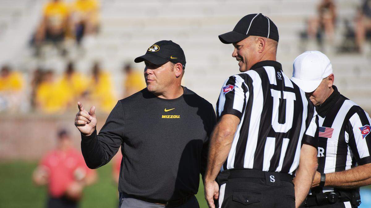 Missouri head football coach Barry Odom (left) spoke with the officials before the start of Saturday’s game against Southeast Missouri State (Sept. 14, 2019).
