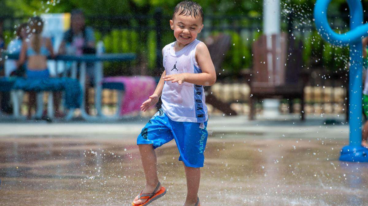 Jaxson Reeves, 4, plays at the splash park at Lea McKeighan park in Lee’s Summit on Wednesday morning, Jun 16, 2021. Kansas City is expected to have its hottest temperatures so far on this Thursday and Friday.