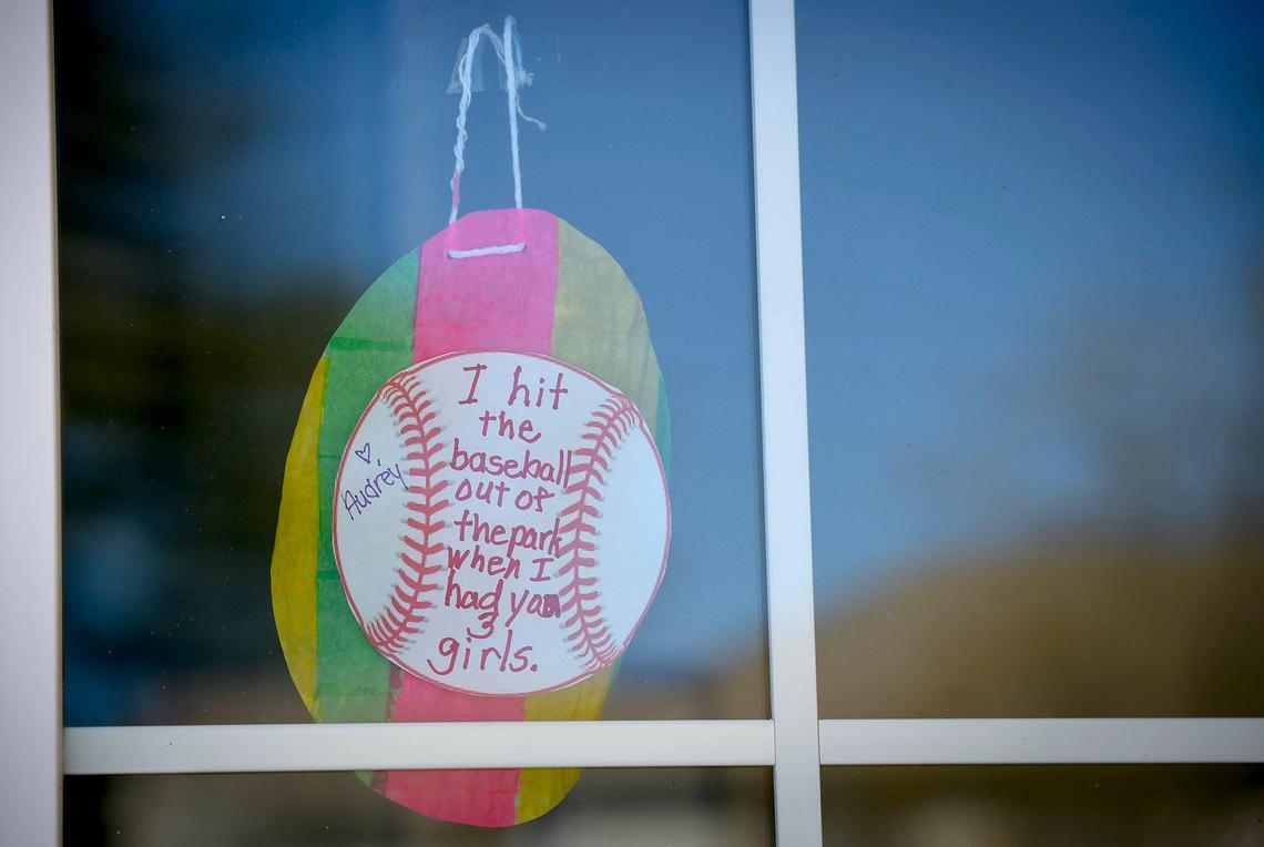 A message from a resident to a family member hangs in the window at Bickford at Mission Springs, an assisted living and memory care facility in Mission, Kansas.