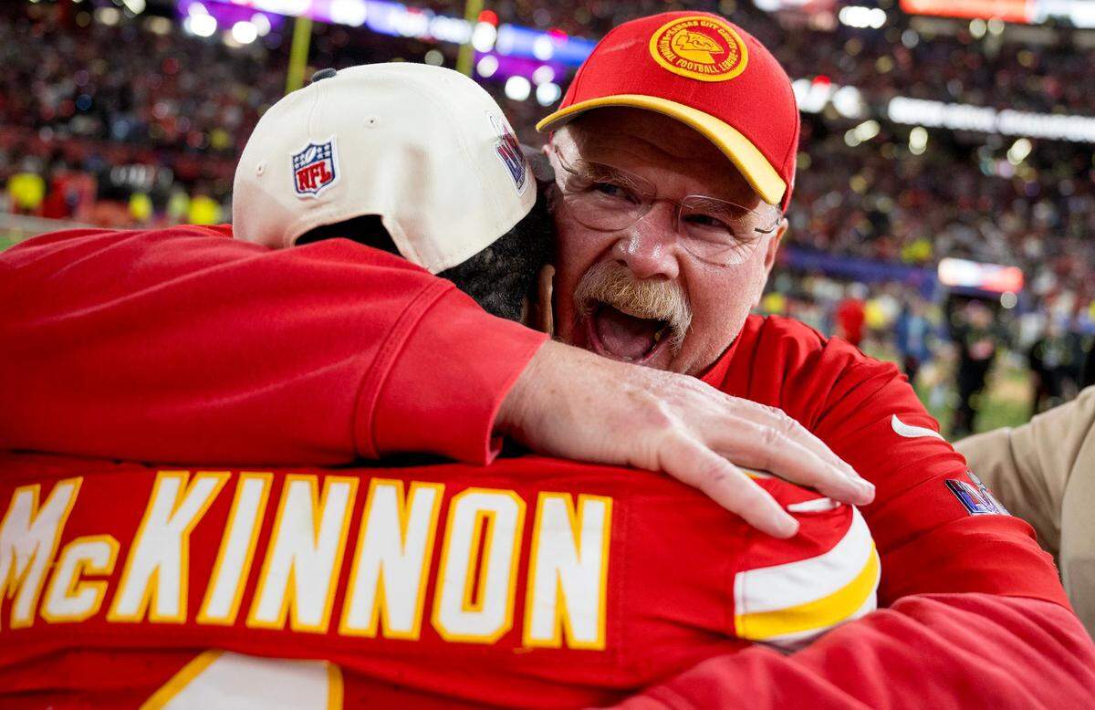 Kansas City Chiefs coach Andy Reid hugs running back Jerick McKinnon (1) after the Chiefs defeated the San Francisco 49ers in overtime 25-22 in Super Bowl LVIII on Sunday, Feb. 11, 2024, in Las Vegas.