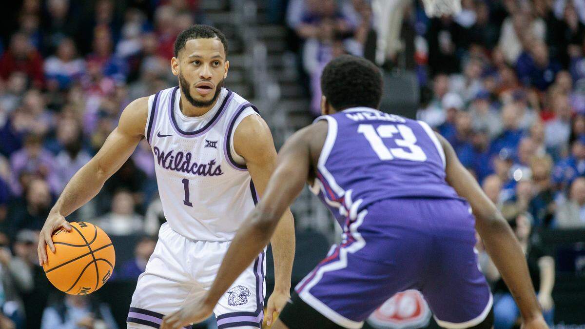 Mar 9, 2023; Kansas City, MO, USA; Kansas State Wildcats guard Markquis Nowell (1) is defended by TCU Horned Frogs guard Shahada Wells (13) during the second half at T-Mobile Center. Mandatory Credit: William Purnell-USA TODAY Sports
