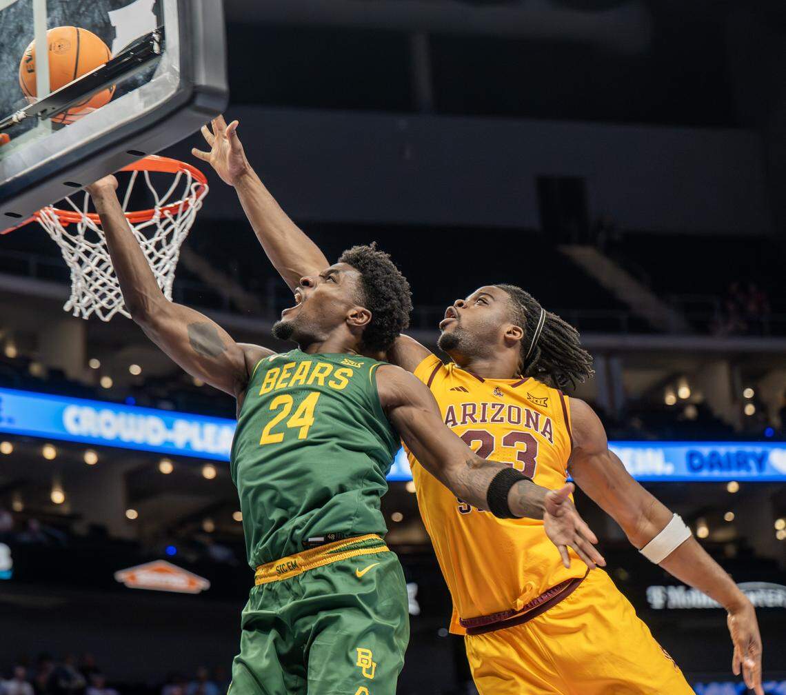 Baylor Bears guard Tounde Yessoufou (24) makes a lay up as Arizona State Sun Devils forward Allen Mukeba (23) attempts to block the shot during the first half of the Big 12 Men's Basketball Tournament at T-Mobile Center on Tuesday, March 10, 2026, in Kansas City.